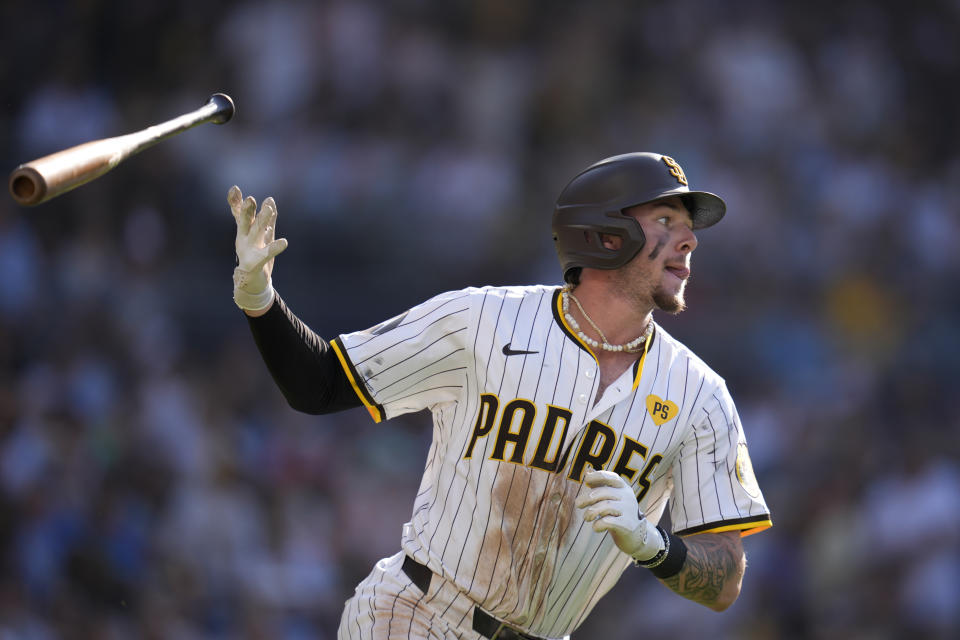 San Diego Padres' Jackson Merrill tosses his bat as he watches his three-run home run during the fourth inning of a baseball game against the Milwaukee Brewers, Saturday, June 22, 2024, in San Diego. (AP Photo/Gregory Bull)