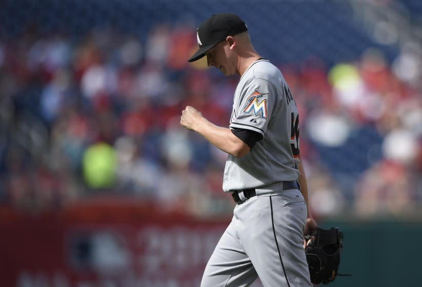 Miami Marlins relief pitcher Scott McGough walks to the dugout.