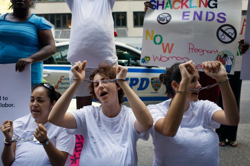 <span class="caption">Activists protest for the end of shackling pregnant women during birth in prison in New York in 2015.</span> <span class="attribution"><a class="link " href="https://mapi.associatedpress.com/v1/items/f50522d3e2584b00b7652bee417bd8f3/preview/AP090818071368.jpg?wm=api&tag=app_id=1,user_id=904438,org_id=101781" rel="nofollow noopener" target="_blank" data-ylk="slk:Yanina Manolova/Associated Press;elm:context_link;itc:0;sec:content-canvas">Yanina Manolova/Associated Press</a></span>
