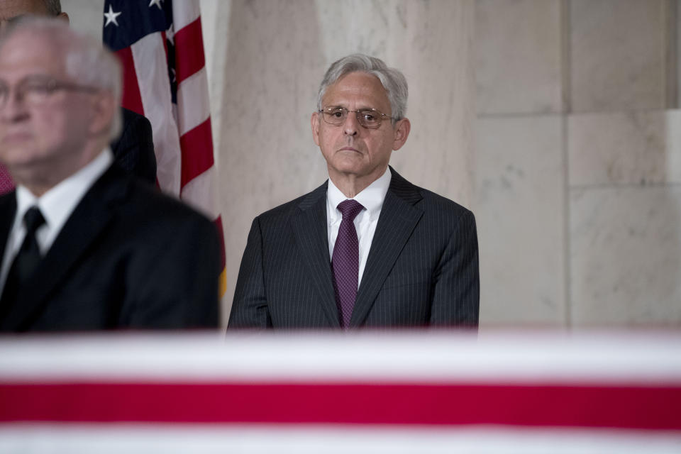 Former President Barack Obama's Supreme Court nominee Merrick Garland pays his respects for the late Supreme Court Justice John Paul Stevens as he lies in repose in the Great Hall of the Supreme Court in Washington, Monday, July 22, 2019. (AP Photo/Andrew Harnik)