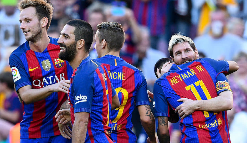 Barcelona team celebrating a goal.