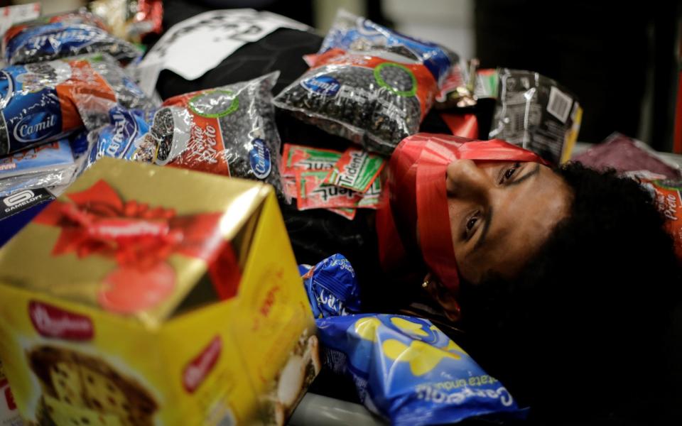 Jonata Anjo protests at a Carrefour supermarket in the Barra da Tijuca neighbourhood in Rio de Janeiro - Antonio Lacerda/EPA-EFE/Shutterstock