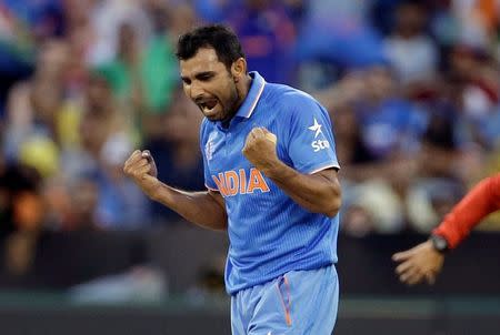 India's Mohammed Shami celebrates dismissing South Africa's Quinton de Kock for seven runs during their Cricket World Cup match at the Melbourne Cricket Ground (MCG) February 22, 2015. REUTERS/Hamish Blair