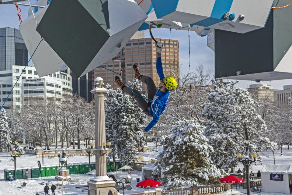 A competitor fights his way to top of the course in the men's Lead event at the 2019 UIAA Ice Climbing World Cup Championships in Denver.