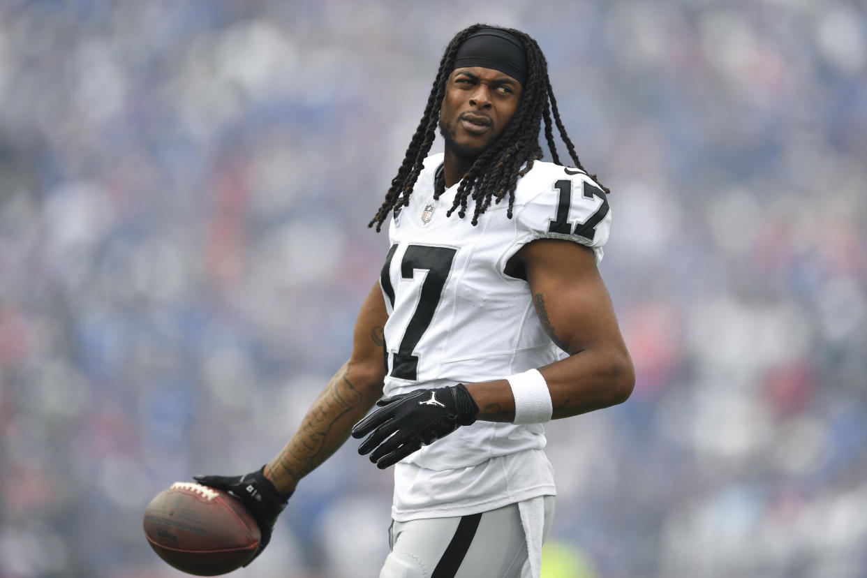 Las Vegas Raiders wide receiver Davante Adams (17) warms up before an NFL football game against the Buffalo Bills in Orchard Park, N.Y., Sunday, Sept. 17, 2023. (AP Photo/Adrian Kraus)