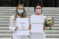 People march to Government Buildings in a bid to allow up to 100 guests to attend their weddings this year in Dublin