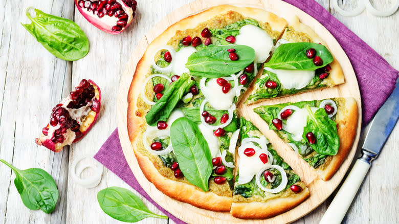 Pomegranate seeds on pizza