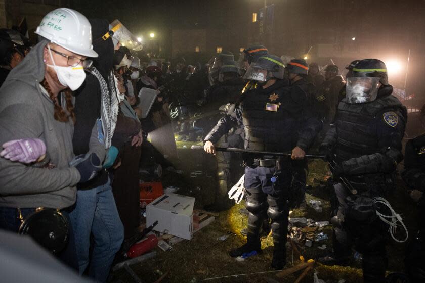 Los Angeles, CA - May 02: Authorities breach and break up a the Pro-Palestinian encampment at UCLA as o on Thursday, May 2, 2024 in Los Angeles, CA. (Jason Armond / Los Angeles Times)