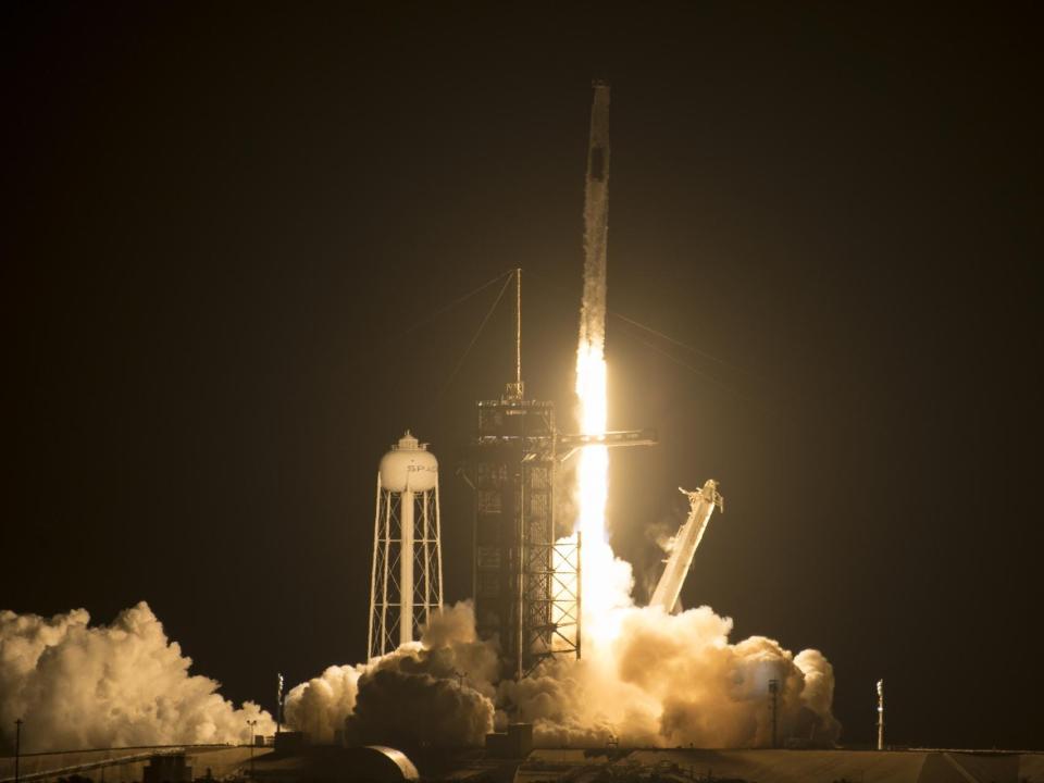 SpaceX Falcon 9 rocket lifts off in the night with crew-2 mission