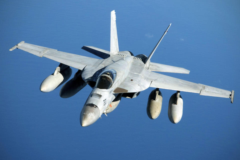 This July 17, 2019, photo provided by the U.S. Air Force shows a Navy F/A-18 Super Hornet in flight after refueling over the Pacific Ocean near the coast of Brisbane, Australia. The Navy said Wednesday, July 31, that an F/A-18 Super Hornet jet similar to this one has crashed in the California desert and a search-and-rescue helicopter is en route to the scene, about 60 miles north of the Naval Air Weapons Station at China Lake. (Senior Airman Elora J. Martinez/U.S. Air Force via AP)
