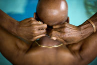 <p>Jacques Ricks, 66, adjusts the straps to his goggles before the start of the 100-meter freestyle swim event in the Dekalb County Senior Olympics in Decatur, Ga. “I was a little nervous but that’s just normal right?” said Ricks, competing in his third olympics, May 19, 2014. (AP Photo/David Goldman) </p>