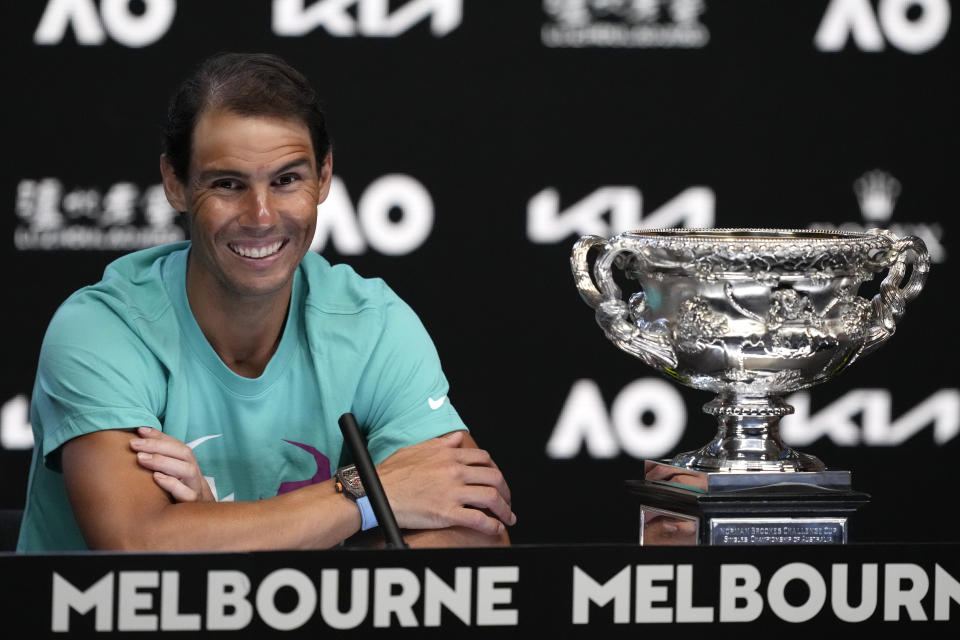 Rafael Nadal of Spain smiles during a press conference following his win over Daniil Medvedev of Russia in the men's singles final at the Australian Open tennis championships in Melbourne, Australia, early Monday, Jan. 31, 2022. (AP Photo/Simon Baker)