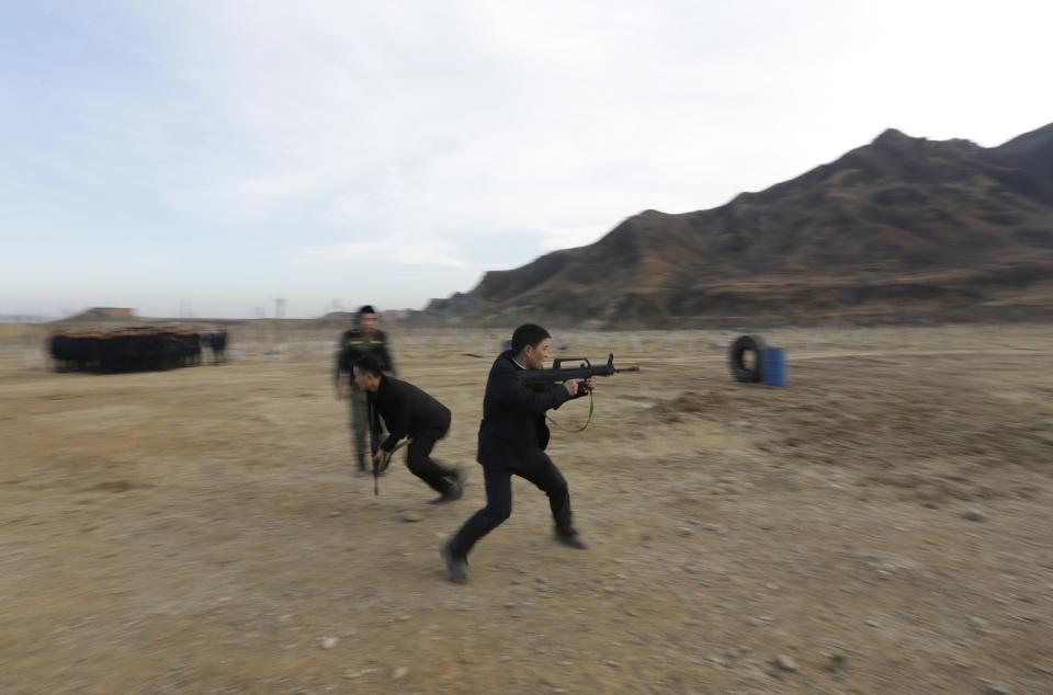 Students take part in training at a field managed by the military during Tianjiao Special Guard/Security Consultant training on the outskirts of Beijing