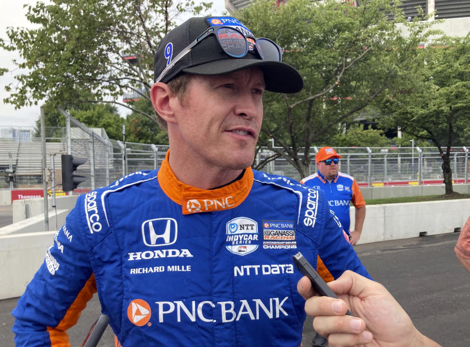 FILE - Six-time IndyCar champion Scott Dixon talks with the media before practice for an IndyCar auto race Aug. 6, 2021, in Nashville, Tenn. The IndyCar season begins Sunday, March 5, 2023, with the Grand Prix of St. Petersburg.(AP Photo/Dan Gelston, File)