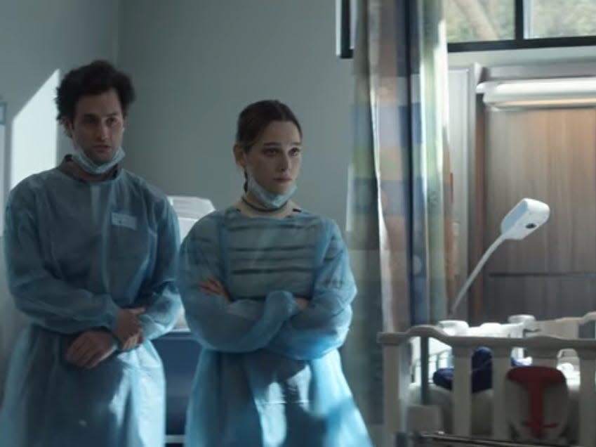 Joe and Love in the hospital wearing scrubs on "You" season three