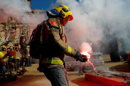 Firemen take part in a protest in front of Catalunya's Parliament in Barcelona, Spain, December 20, 2018. REUTERS/Juan Medina