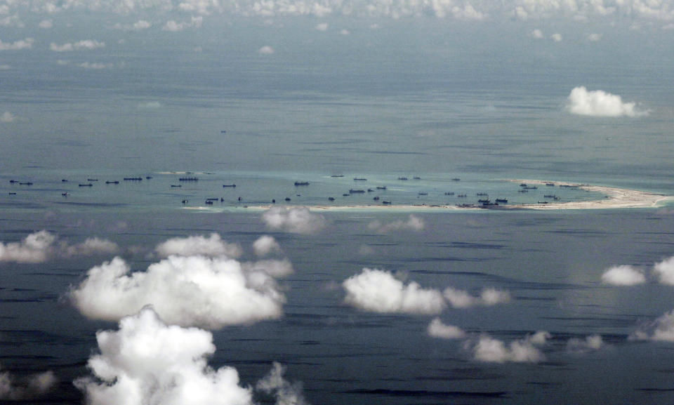 FILE - This May 11, 2015, file photo, shows land reclamation of Mischief Reef in the Spratly Islands in the South China Sea. China has reportedly deployed a Zeppelin-like airship to Mischief Reef in the South China Sea. (Ritchie B. Tongo/Pool Photo via AP, File)