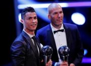 Soccer Football - The Best FIFA Football Awards - London Palladium, London, Britain - October 23, 2017 Real Madrid’s Cristiano Ronaldo celebrates after winning The Best FIFA Men’s Player Award with Real Madrid coach Zinedine Zidane REUTERS/Eddie Keogh