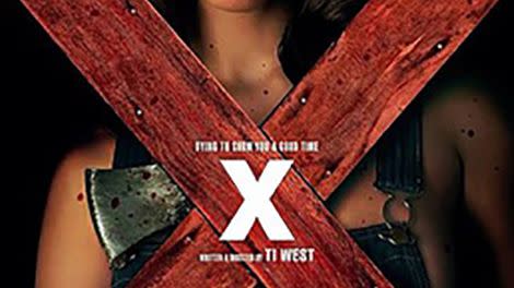 the poster for the classic horror movie x, which features a young woman behind two wooden beams that make an x