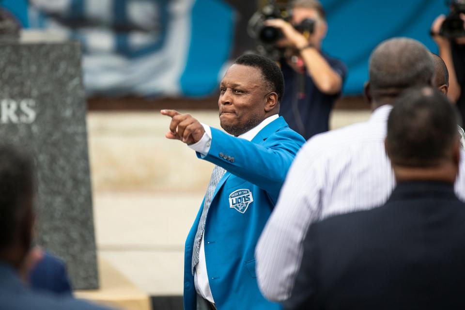 Barry Sanders shows appreciation for fans after speaking during the ceremony to unveil his statue outside of Ford Field in Detroit on Saturday, Sept. 16, 2023.