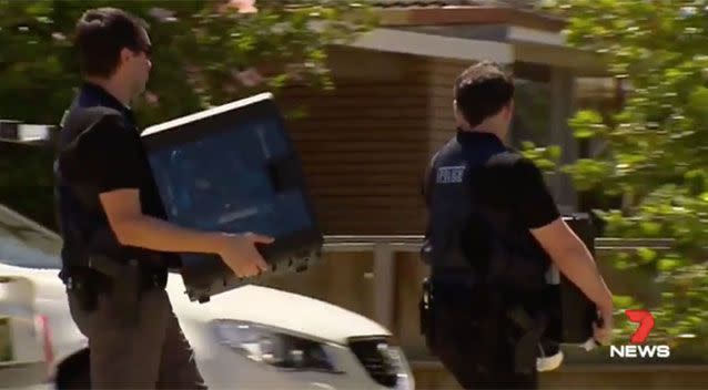 Computers, camcorders and dozens of cardboard boxes were also seized from the Kewdale scene. Source: 7 News