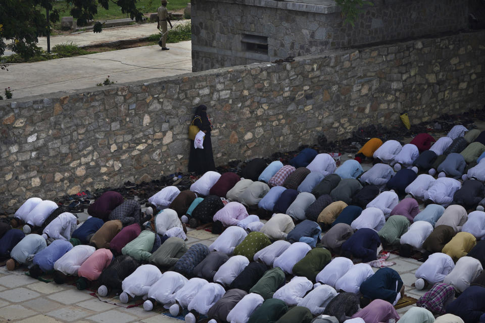 Muslims offer Eid al-Adha prayers at the Quli Qutub Shahi tombs in Hyderabad, India, Thursday, June 29, 2023. Muslims around the world will celebrate Eid al-Adha, or the Feast of the Sacrifice, slaughtering sheep, goats, cows and camels to commemorate Prophet Abraham's readiness to sacrifice his son Ismail on God's command. (AP Photo/Mahesh Kumar A.)