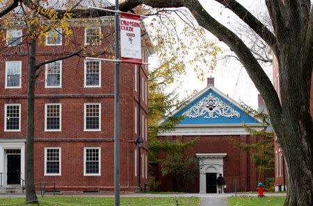 FILE PHOTO: A man walks through Harvard Yard at Harvard University in Cambridge, Massachusetts, U.S., November 16, 2012. REUTERS/Jessica Rinaldi/File Photo