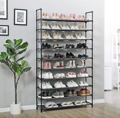 Store up to fifty pairs of shoes on this tall and slim hallway rack