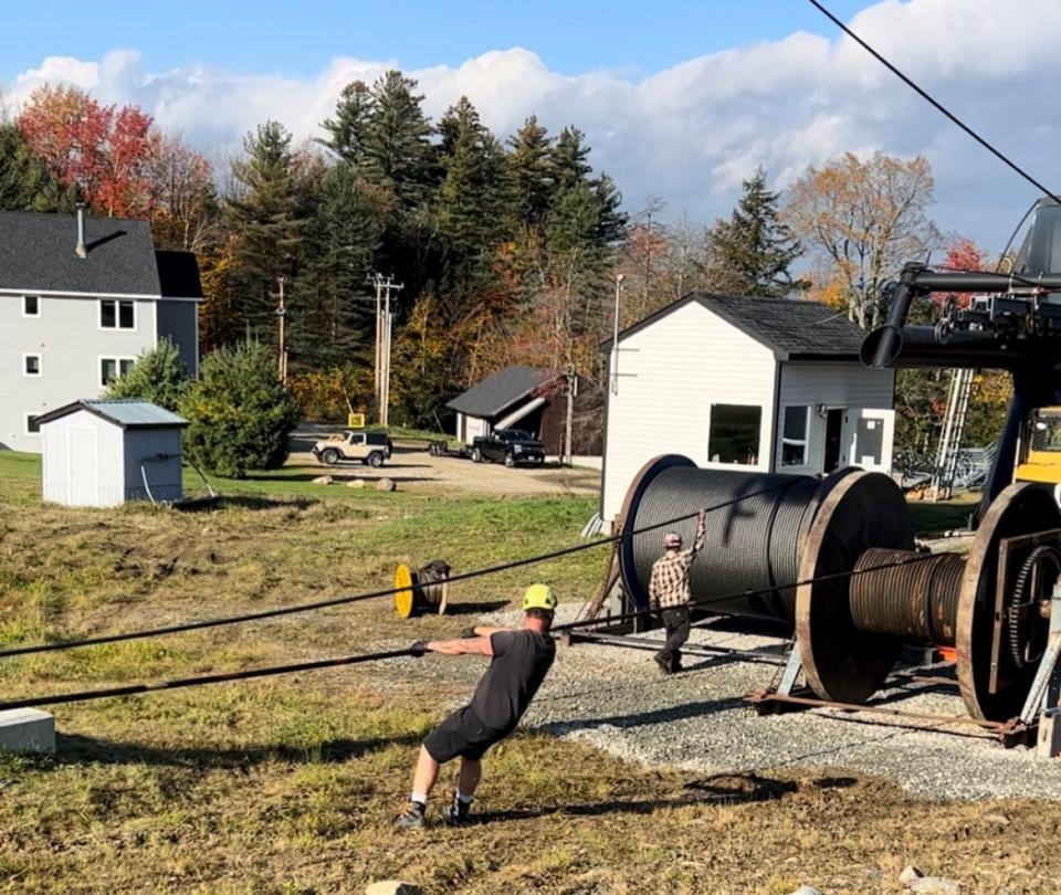 Installing two miles of cable for a new lift at Magic Mountain ski area in Londonderry. The qud lift opened in February, a "turning point" for the resort, according to a spokesman.