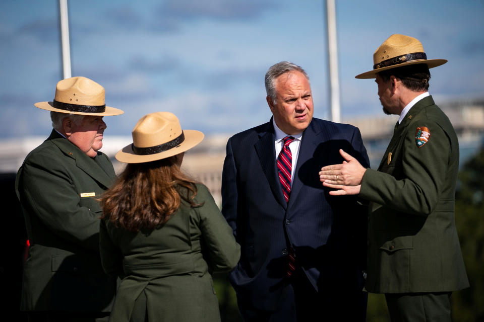 U.S. Interior Secretary David Bernhardt speaks with park rangers before first lady Melania Trump participates in a ribbon cutting and ceremonial ride to the top, to celebrate the re-opening of the Washington Monument, after a 37-month closure to modernize the elevator control system and construct a new security screening facility, in Washington, Sept. 19, 2019. (Photo: Al Drago/Reuters)