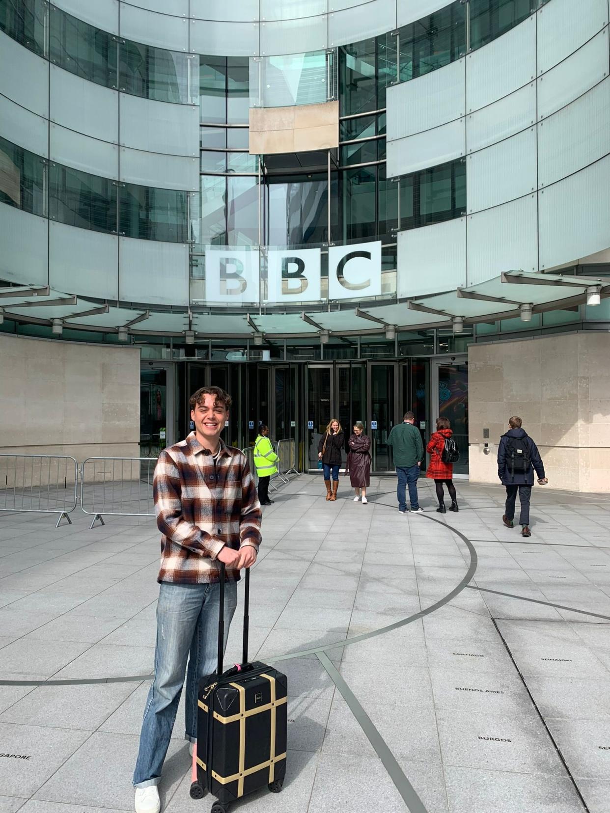 Man posing outside building 