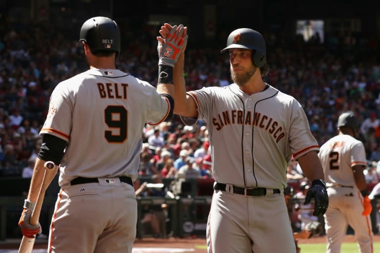 San Francisco Giants pitcher Madison Bumgarner celebrates the first of two home runs against the Arizona Diamondbacks