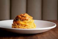 <p>The brains behind New York's fashionable Scarpetta restaurant have opened its first outpost in London. Sette, which is housed within the elegant confines of the Bulgari hotel in Knightsbridge, is a luxury take on New York-inspired Italian food - so big portions, plenty of sauce and thick pasta noodles. Its tomato and basil pasta is its signature, made with the sweetest, juiciest of ingredients. The crudi plates are also well worth splashing out on - the yellowtail fish simply served with olive oil and onions is particularly good. In terms of sides, order the charred asparagus, which is topped with an poached egg that opens to reveal the most golden of yolks. Make room for the espresso budino dessert, a rich take on tiramisu and topped with salted caramel and hazel nut ice cream.</p><p><a href="https://www.settelondon.co.uk/" rel="nofollow noopener" target="_blank" data-ylk="slk:Sette;elm:context_link;itc:0;sec:content-canvas" class="link ">Sette</a>, Ground Floor, 4 Knightsbridge Green, SW1X 7QA</p>