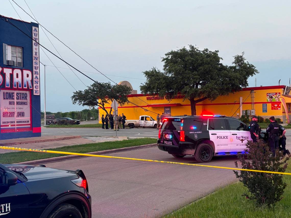 Police officers and firefighters at the scene where injuries were reported following a vehicle crash during a police pursuit on Hemphill Street in south Fort Worth on Monday night, May 6, 2024.