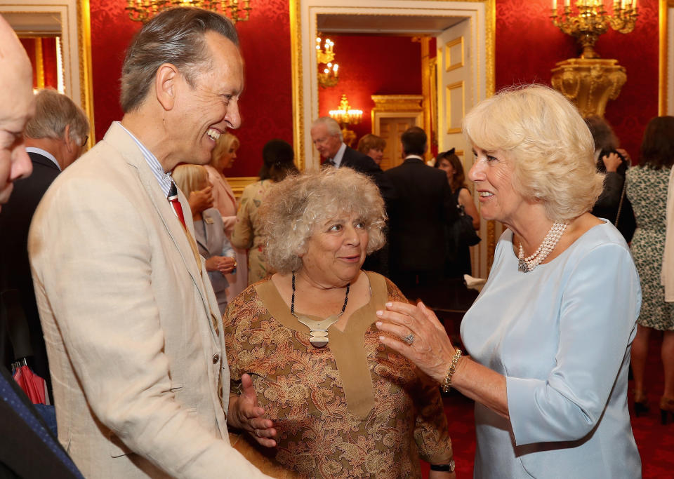 LONDON, ENGLAND - JULY 12:  Camilla, Duchess of Cornwall shares a joke with Richard E Grant and Miriam Margolyes as she hosts the 30th Anniversary Garden Party for the National Osteoporosis Society in St James Palace on July 12, 2016 in London, England. Due to inclement weather the event was moved indoors. The Duchess of Cornwall has been connected with the charity for nearly 30 years.  (Photo by Chris Jackson/Getty Images)