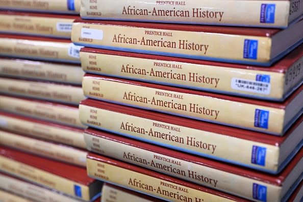 Books are piled up in the classroom for students takeing AP African-American Studies at Overland High School on November 1, 2022 in Aurora, Colorado. The AP African-American Studies course is part of a national pilot class that about 60 schools nationwide are participating in. (Photo by RJ Sangosti/MediaNews Group/The Denver Post via Getty Images)
