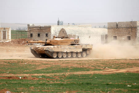 A Turkish tank drives east of al-Bab town, Syria March 9, 2017. REUTERS/Khalil Ashawi