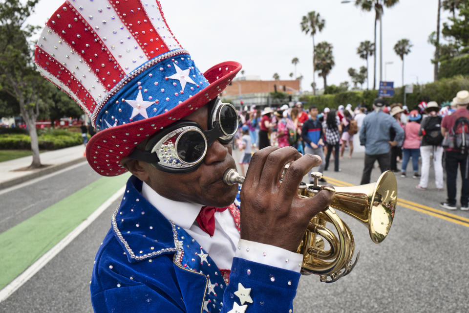 A trumpeter who went only by the name Lenny plays a tune during the Santa Monica Fourth of July parade Thursday, July 4, 2019 in Santa Monica, Calif. (Photo: Richard Vogel/AP)