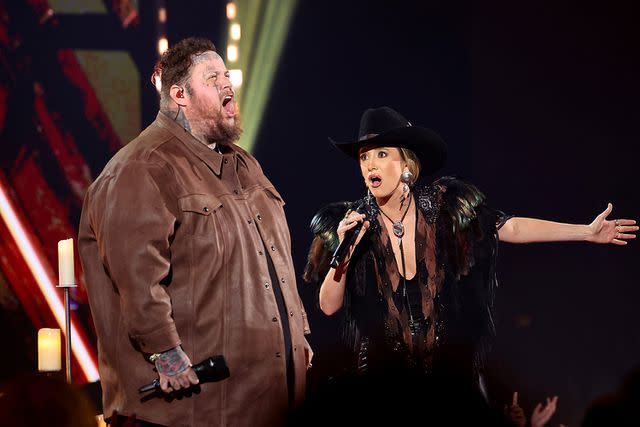 <p>Amy Sussman/Getty</p> Jelly Roll and Lainey Wilson perform during the iHeartRadio Music Awards in Los Angeles in April 2024