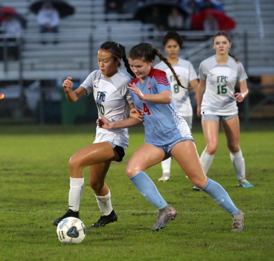 Flagler Palm Coast High's Ivy Chen (10) and Seabreeze's Kayla Frederick (4) battle for control, Thursday January 18, 2024, during the Five Star Conference girls soccer final.