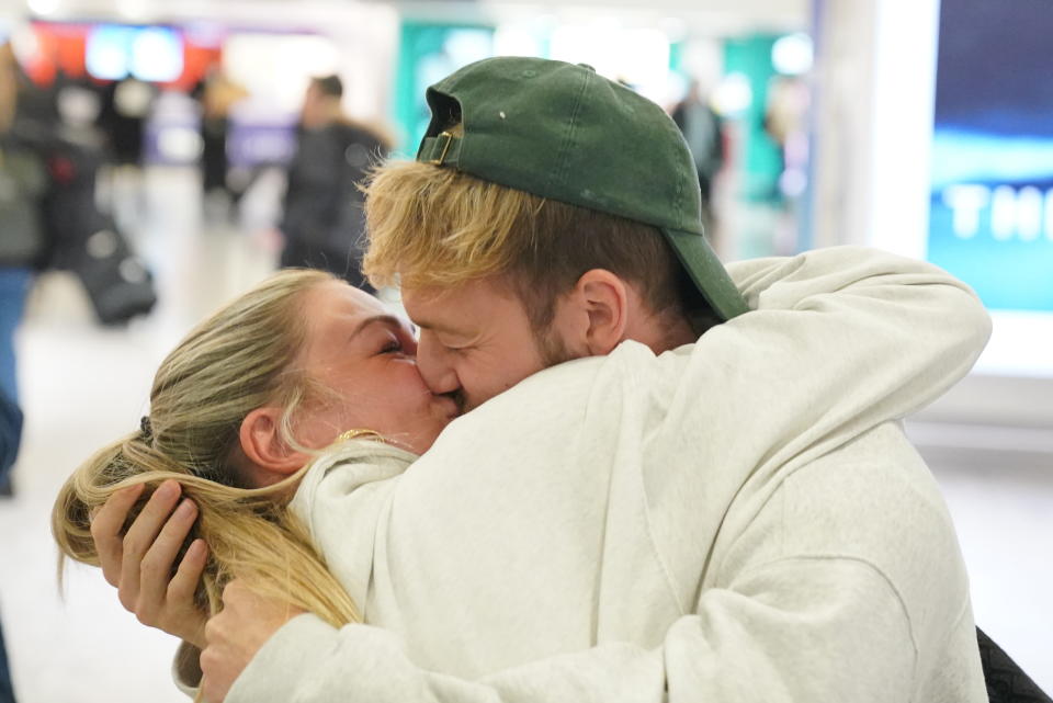 Series winner Sam Thompson (right) is greeted by Zara McDermott at Heathrow Airport, London, after taking part in the ITV series I'm A Celebrity Get Me Out Of Here! in Australia. Picture date: Wednesday December 13, 2023. (Photo by Jonathan Brady/PA Images via Getty Images)