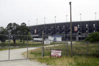A gate is locked outside Darlington Raceway Sunday, May 17, 2020, in Darlington, S.C. NASCAR, which has been idle since March 8 because of the coronavirus pandemic, makes its return at the track with the Real Heroes 400 Nascar Cup Series auto race Sunday. (AP Photo/Brynn Anderson)