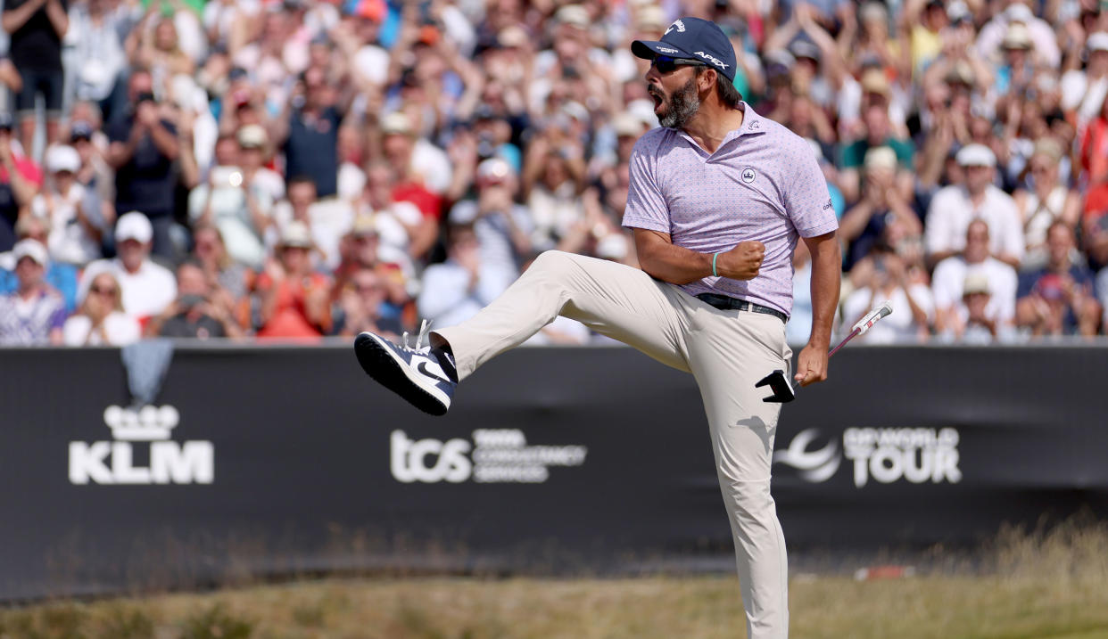  Larrazabal fist pumps and kicks his leg after holing the winning putt 