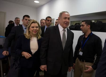 Israeli Prime Minister Benjamin Netanyahu (2ndR) and his wife Sara arrive at a courtroom to testify in a libel lawsuit they filed against an Israeli journalist, at the Magistrate Court in Tel Aviv, Israel March 14, 2017. REUTERS/Heidi Levine/Pool