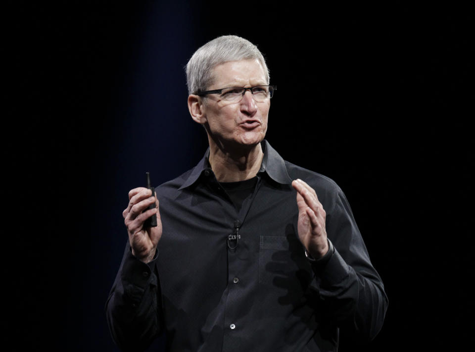 Apple CEO Tim Cook speaks at the Apple Developers Conference in San Francisco, Monday, June 11, 2012. Apple says it's introducing a laptop with a super-high resolution "Retina" display, setting a new standard for screen sharpness.The new MacBook Pro will have a 15-inch screen and four times the resolution of previous models, Cook told developers at a conference in San Francisco. (AP Photo/Paul Sakuma)