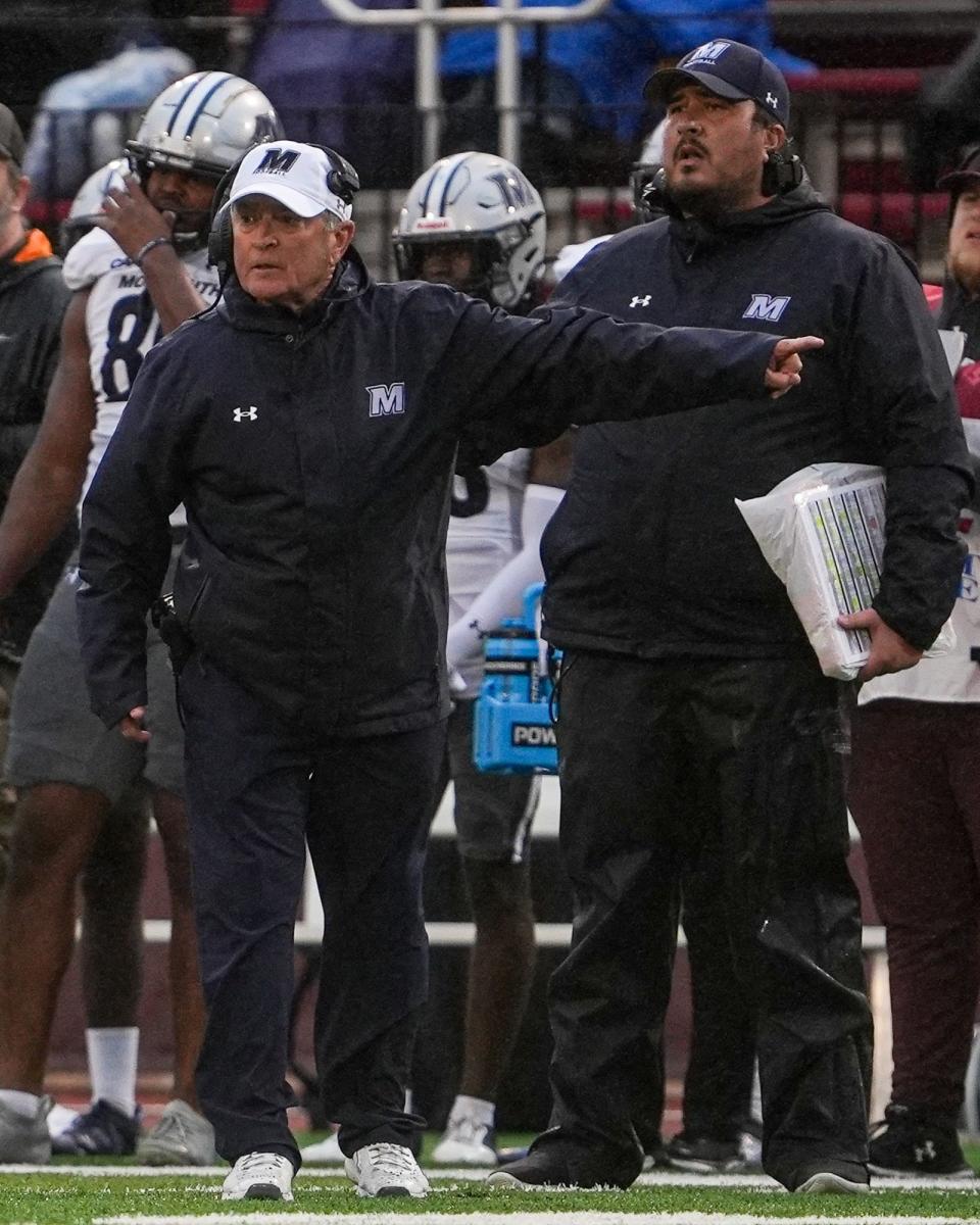 Monmouth head coach Kevin Callahan (left) points out instructions during a loss at Lafayette during the 2023 season.