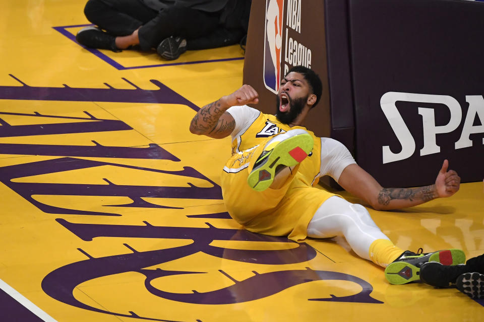 Los Angeles Lakers forward Anthony Davis yells after scoring during the second half of the team's NBA basketball game against the New Orleans Pelicans on Friday, Jan. 3, 2020, in Los Angeles. The Lakers won 123-113. (AP Photo/Mark J. Terrill)
