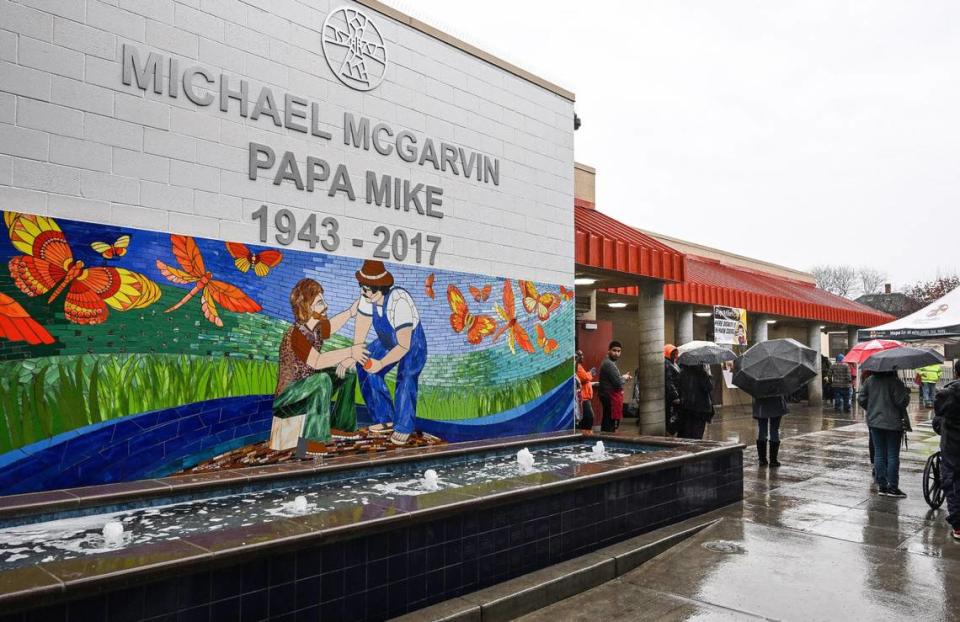 A mural and fountain dedicated to Poverello House founder Mike McGarvin stands in front of the shelter’s new Papa Mike’s Café which provides a no-cost meal in a restaurant setting for anyone in the community.