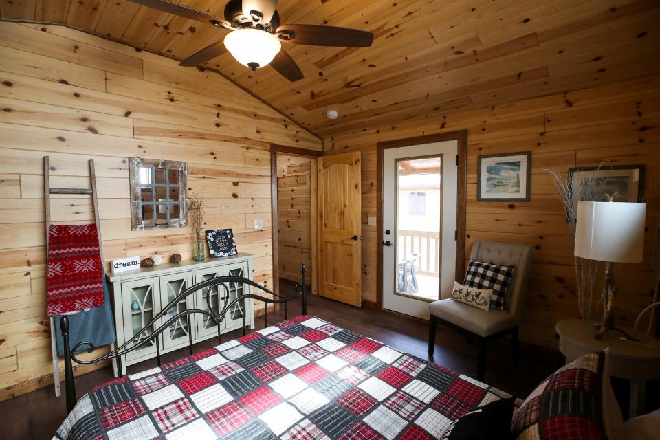 The main bedroom of an Amish Made Cabin.   The manufacturer in Shepherdsville is a family-owned-and-operated business that has been building modular cabins for nearly 16 years.  Each cabin is constructed at their manufacturing shop in Munfordville, then delivered to their destinations.