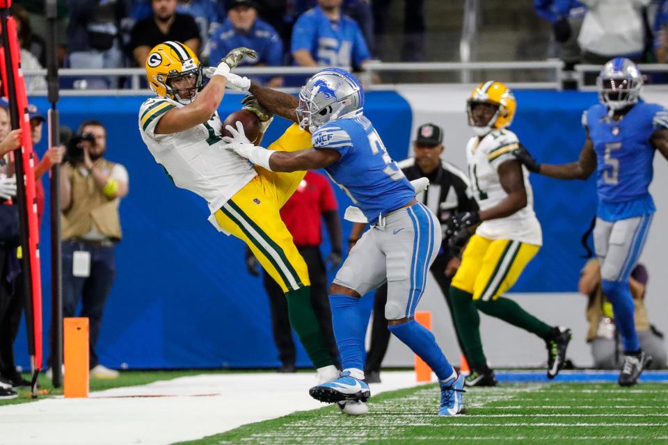 Detroit Lions cornerback Jerry Jacobs (39) tackles Green Bay Packers wide receiver Allen Lazard (13) during the first half at Ford Field, Nov. 6, 2022.